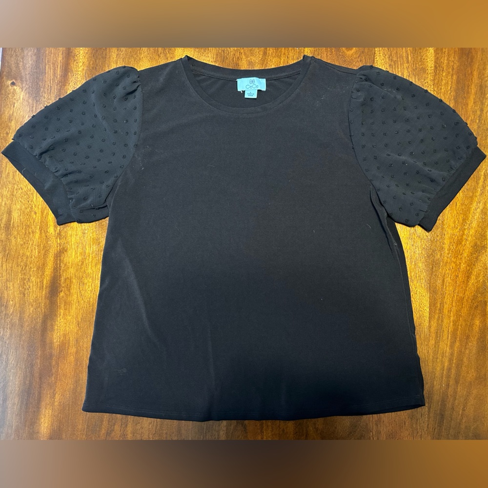 Black puff sleeve CeCe top. Fits at waist.